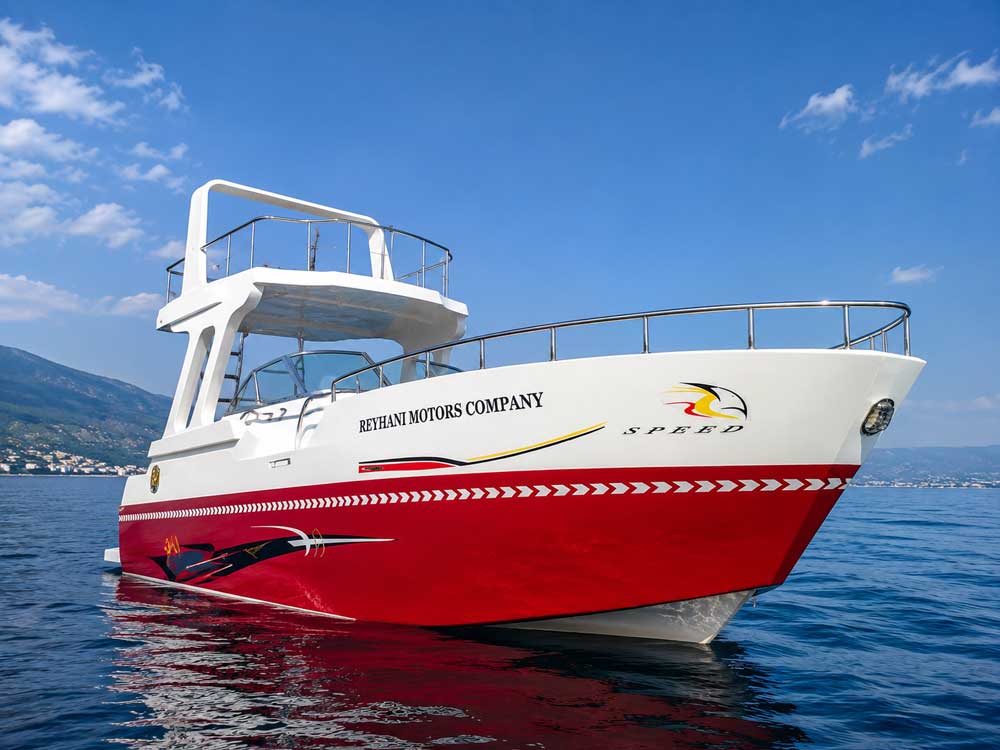 Reyhani Motors double-deck recreational boat with a white and red hull at sea